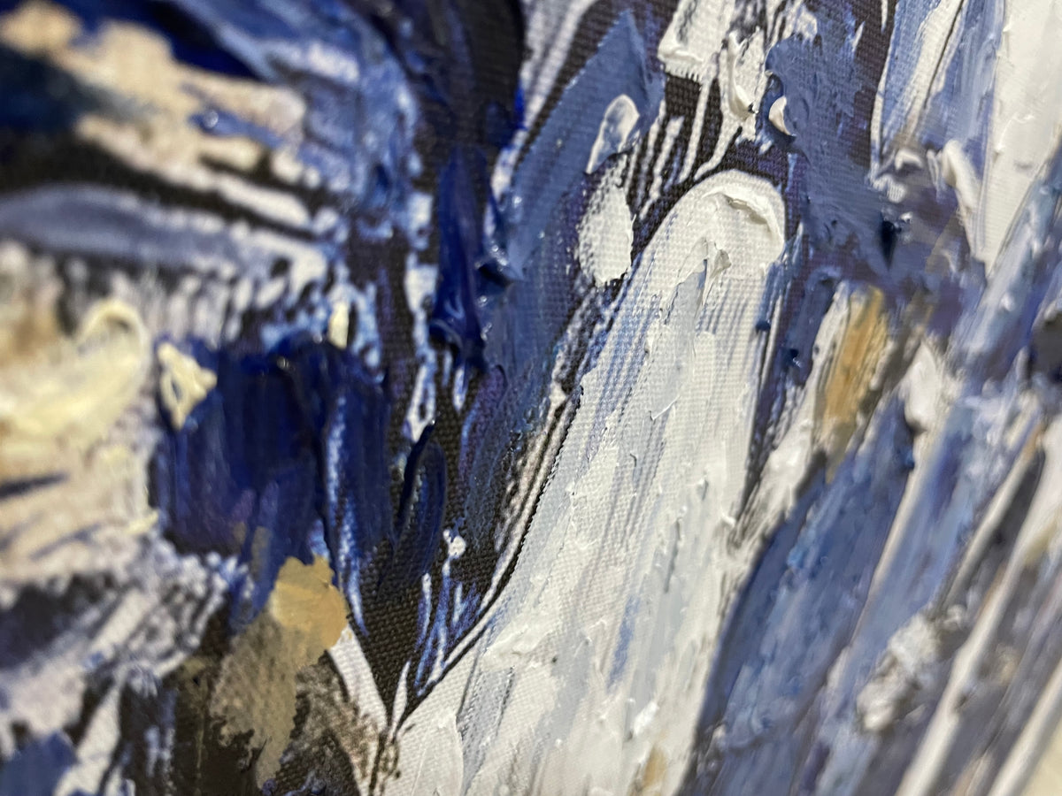 Close-up of a wedding decoration featuring blue and gold accents from Lehava Art, showcasing intricate design details.